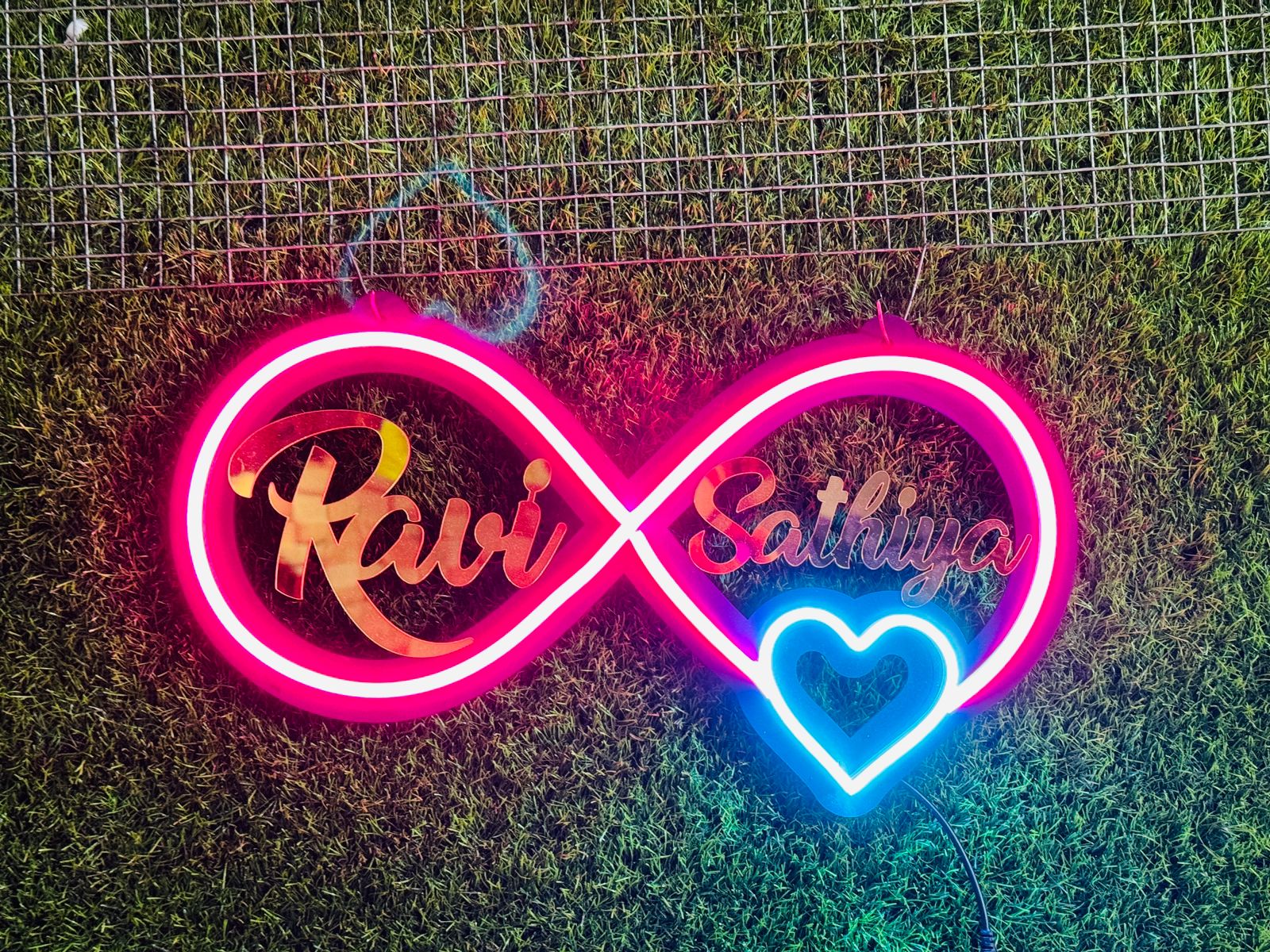 The image features a personalized infinity neon sign, highlighting its romantic appeal and customization options, perfect for special occasions or home decor.